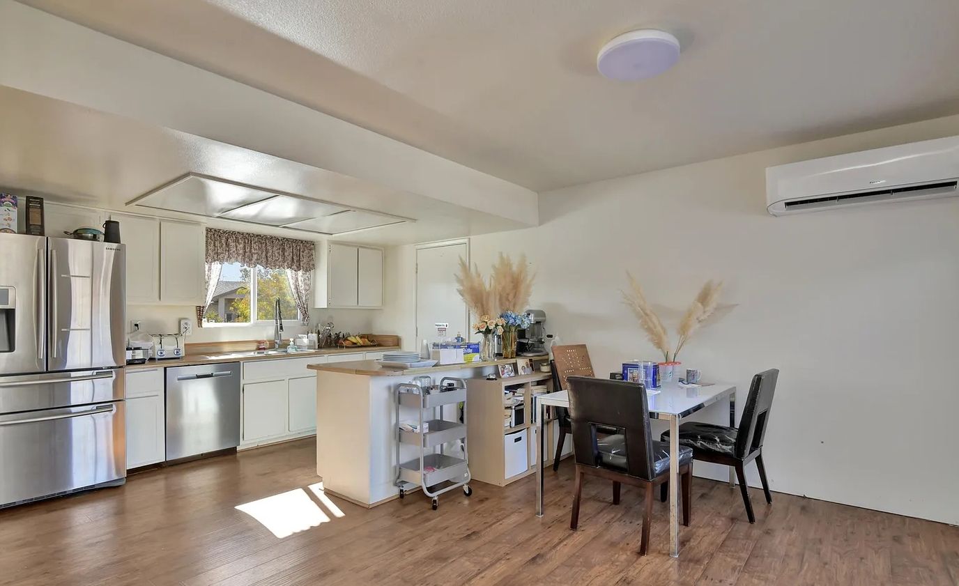 Bright kitchen with modern appliances and a dining area