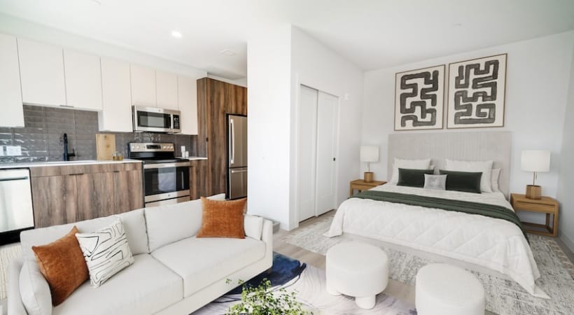 Modern interior view of a bedroom and living area
