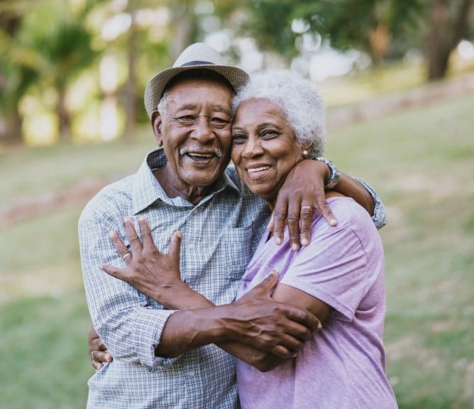 Happy senior couple embracing outdoors