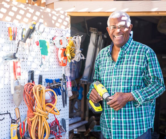 Resident happily engaged in a woodworking project