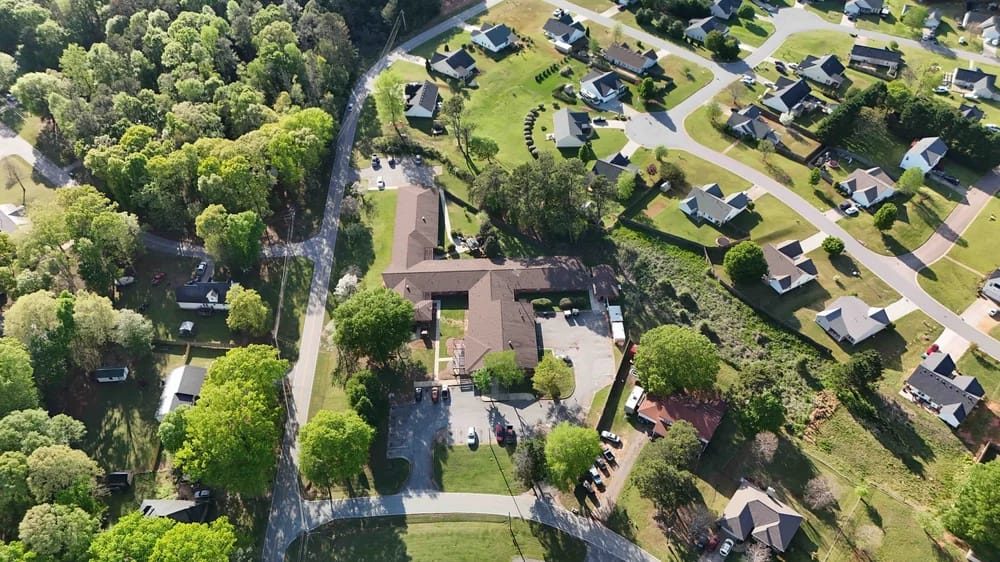 Aerial view of Hill Haven Nursing Home surrounded by greenery