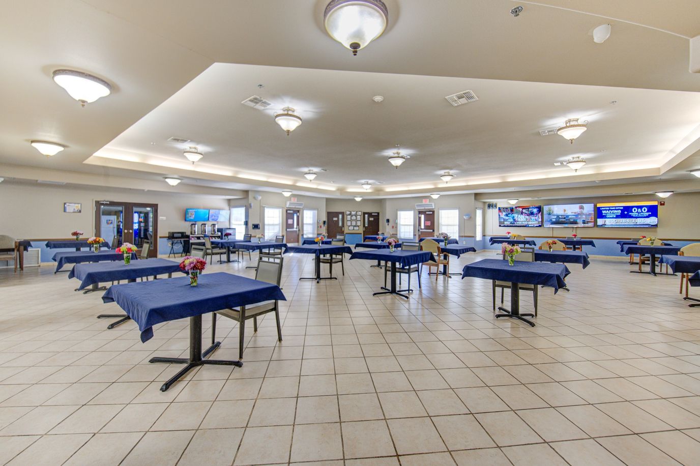 Dining room with tables set for residents