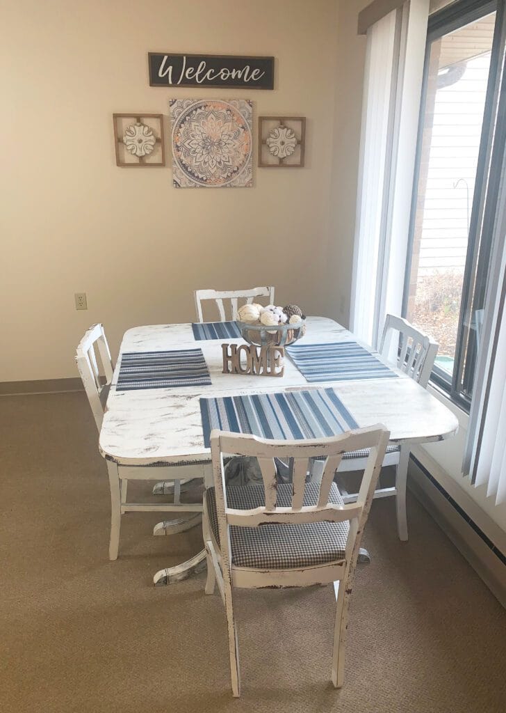 Cozy dining setup with a welcome sign