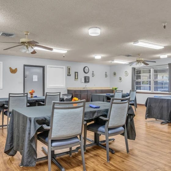 Dining area with tables and chairs in a warm setting