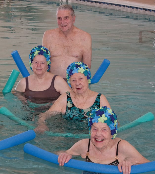 Residents enjoying an exercise class in the pool