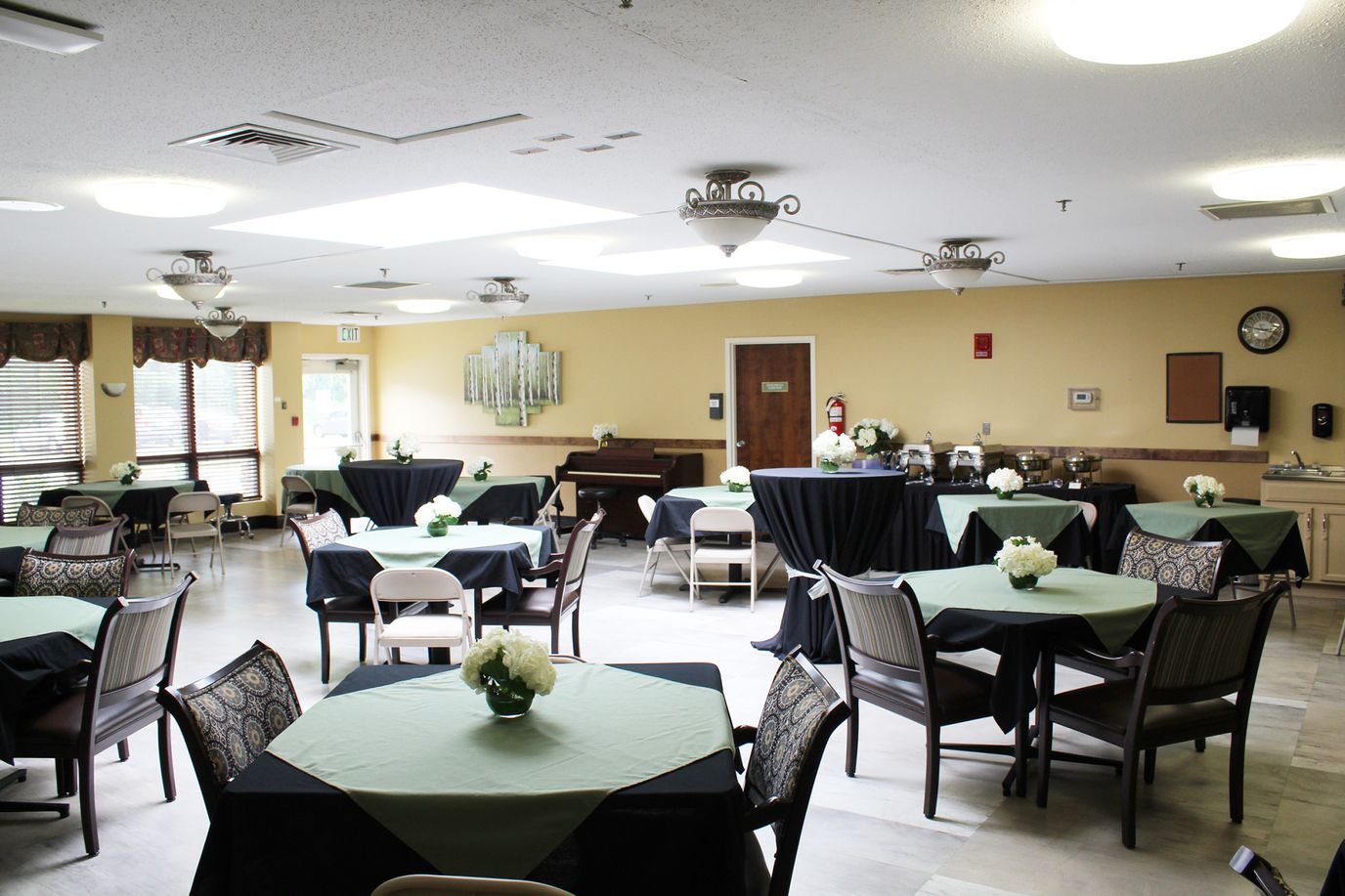 Spacious interior dining area with tables and flowers