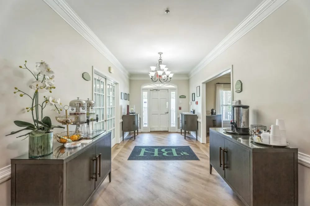 Bright interior hallway leading to a common area