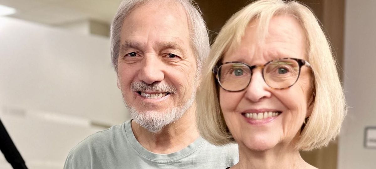 Two residents smiling in a common area