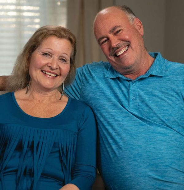 Two smiling residents sitting together