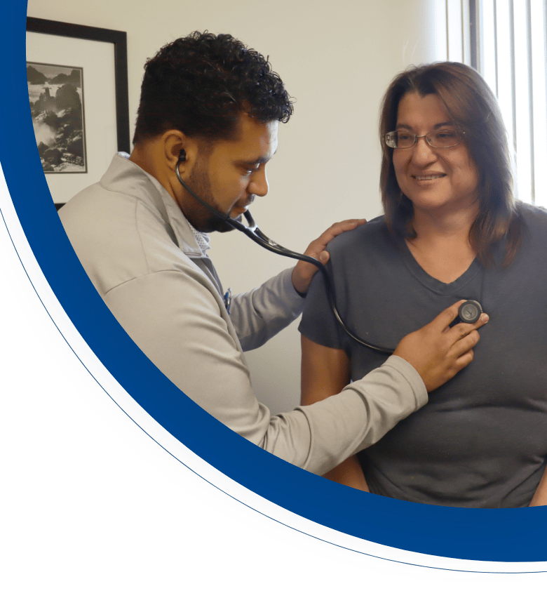 Healthcare professional checking a patient's heartbeat