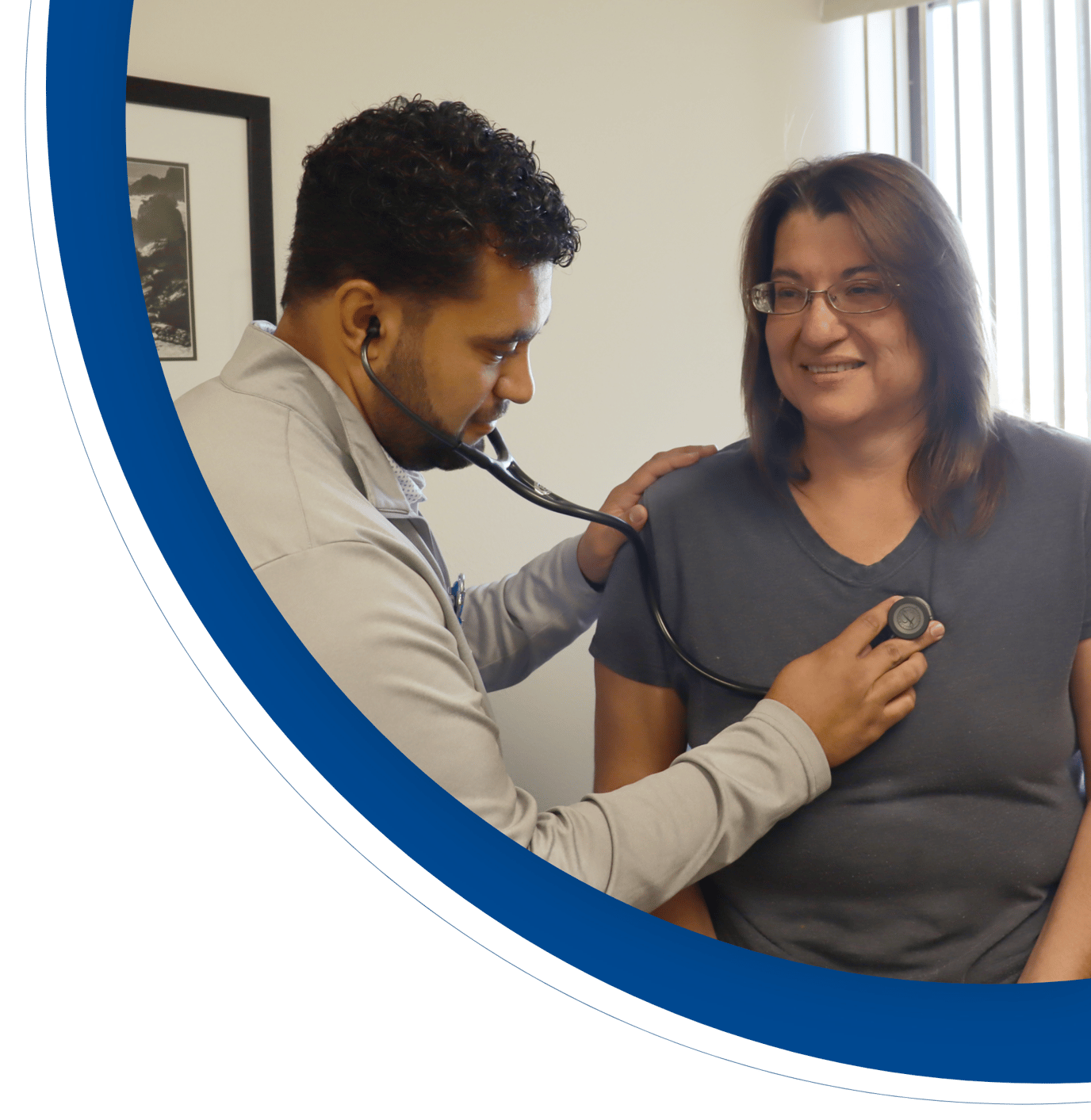 Staff member checking a resident's heartbeat in an office