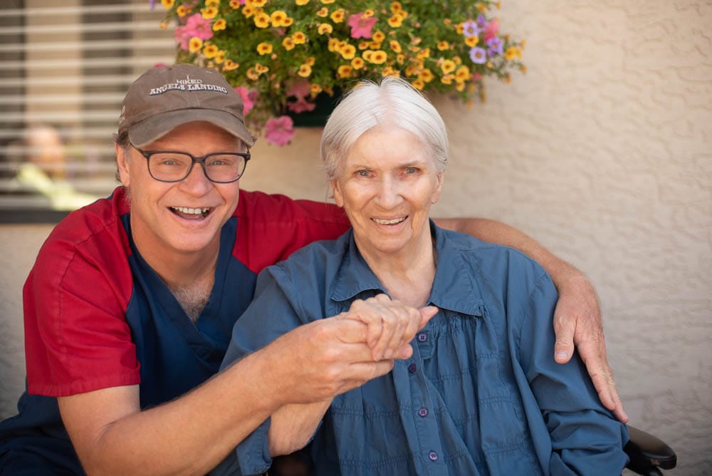 Caregiver and resident enjoying a moment outdoors