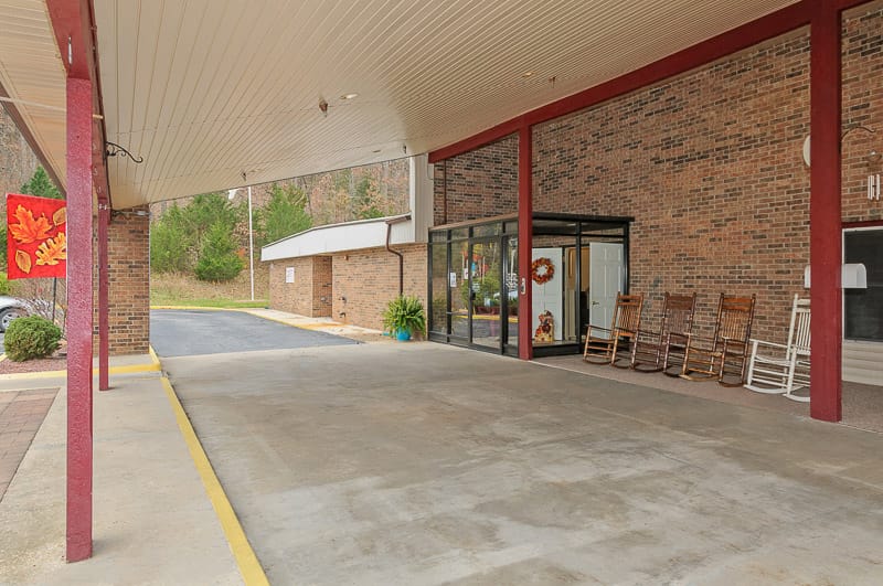 Covered entrance at the facility with rocking chairs