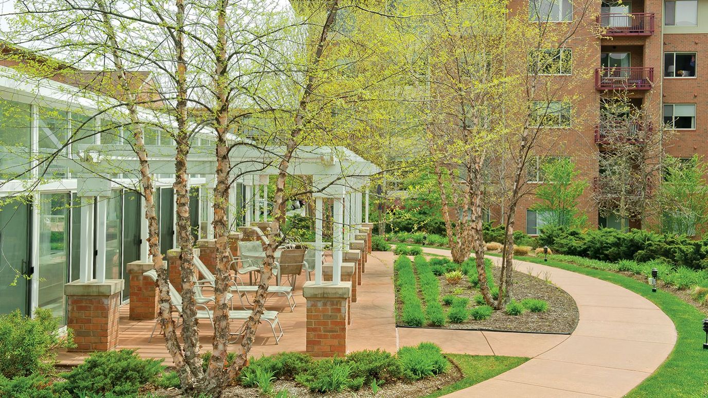 Pathway through landscaped outdoor space at the facility