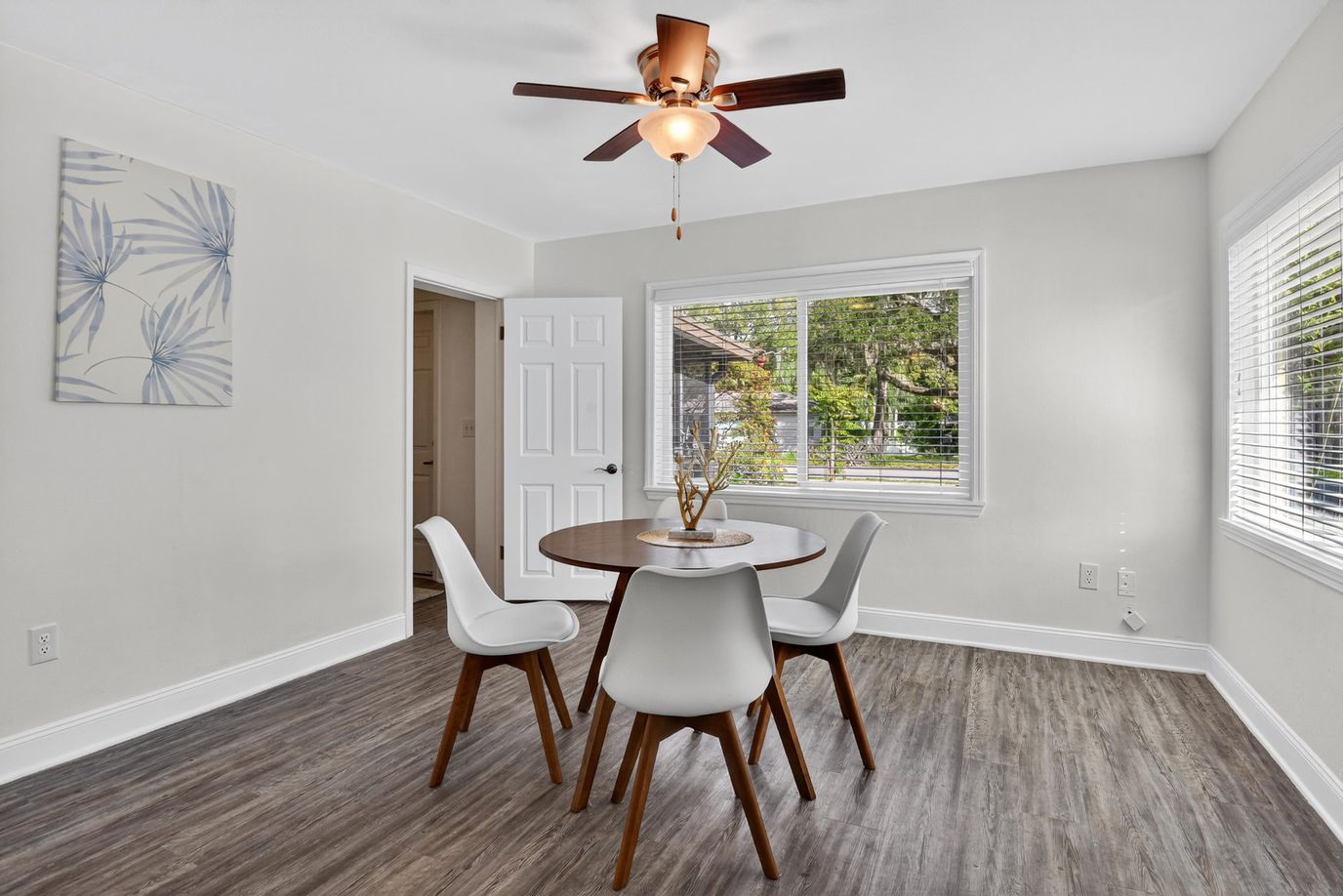 Bright interior space with a dining table and chairs