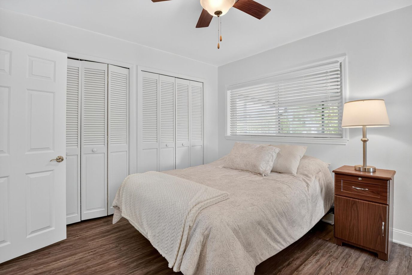 Cozy private bedroom with a bed and lamp