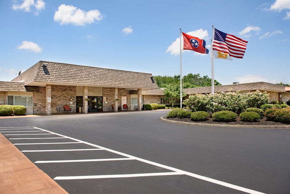 Exterior view of Life Care Center of Morristown with flags