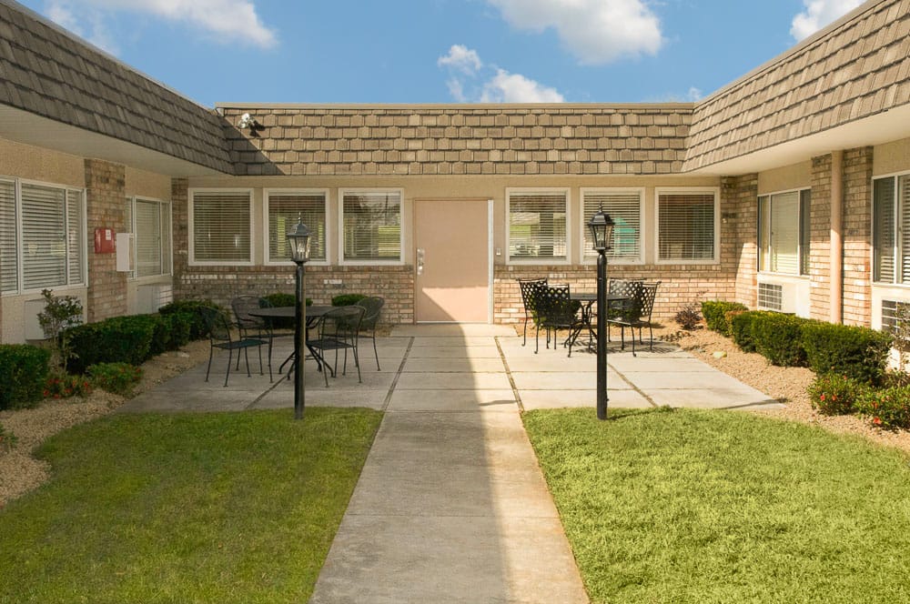 Outdoor courtyard with seating and landscaping