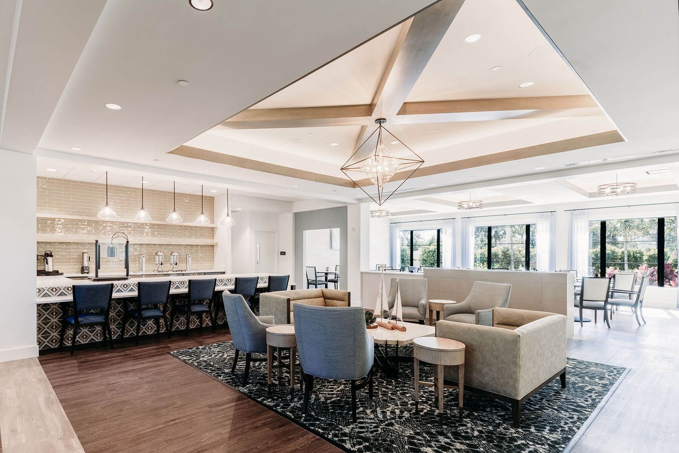 Bright interior common area with seating and bar