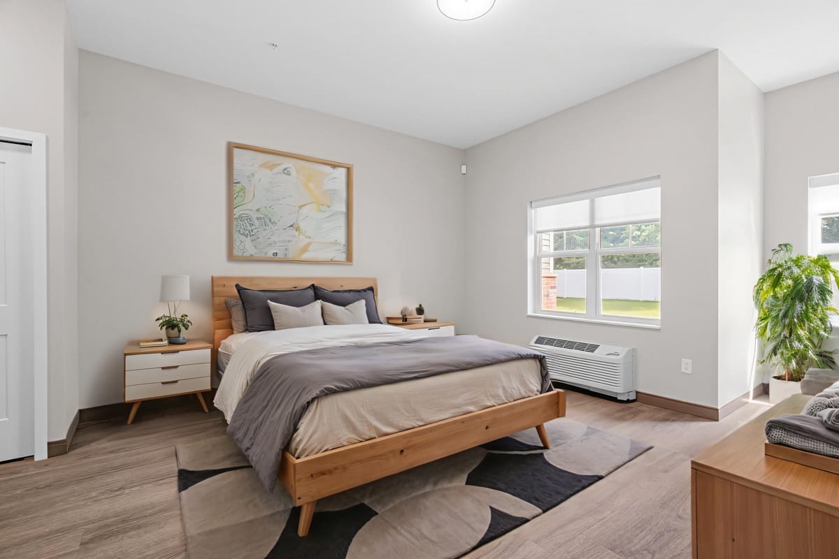 Modern bedroom with cozy furnishings and natural light