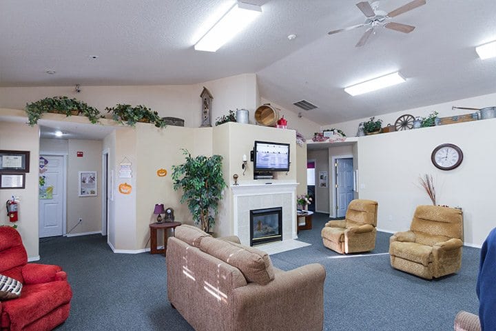 Common area with seating and fireplace