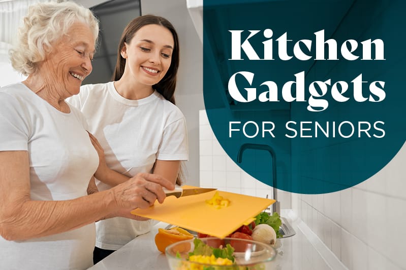 Two seniors engaging in kitchen activity with gadgets