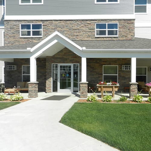 Exterior view of Heritage Pointe entrance with landscaping