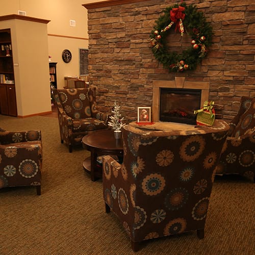 Cozy common area with festive decorations and seating