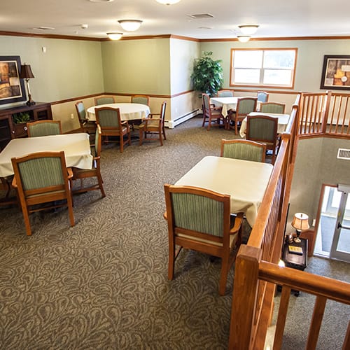 Interior view of a common dining area with tables and chairs