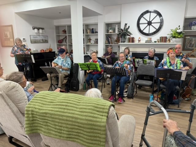 Residents participating in a music activity in a common area