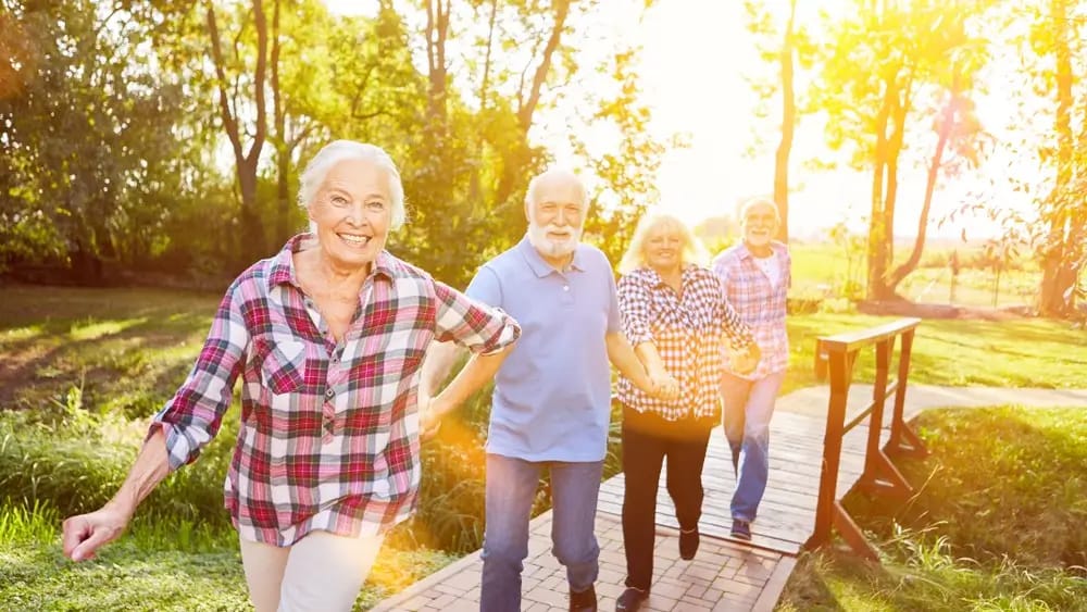Residents enjoying a stroll on a sunny path