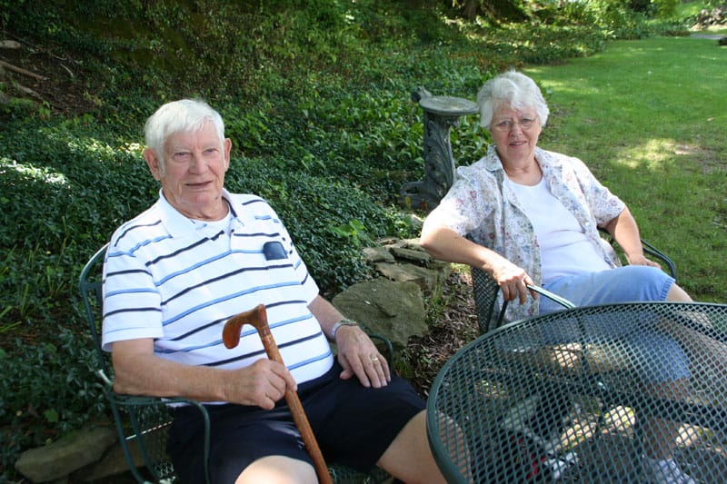 Two residents enjoying the outdoor space at Westwind Manor