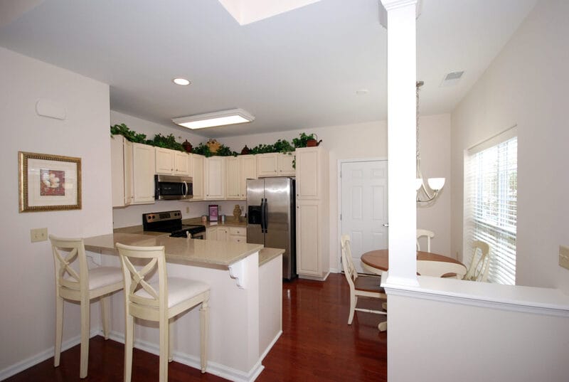 A bright kitchen area with dining space