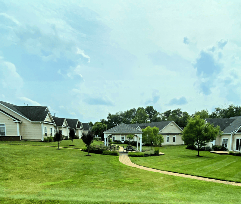 Outdoor view of a senior living facility's garden and buildings