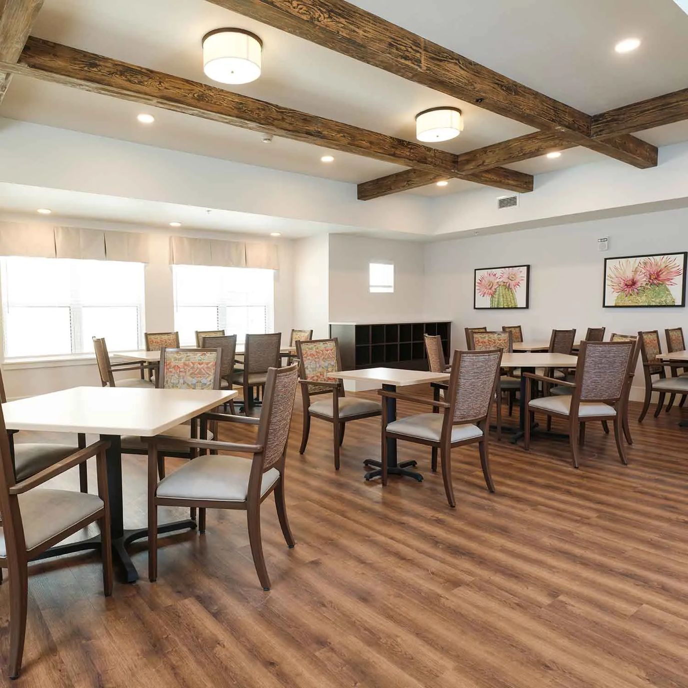 Bright common area with tables and chairs
