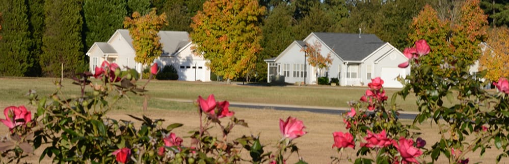 Exterior view of Maples of Honea Path surrounded by flowers