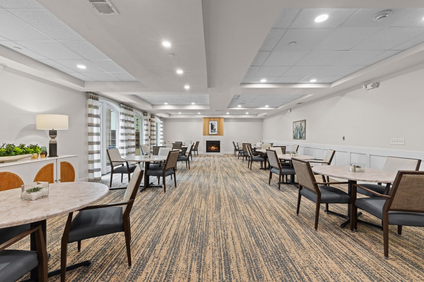 Dining room with tables and chairs in a bright interior