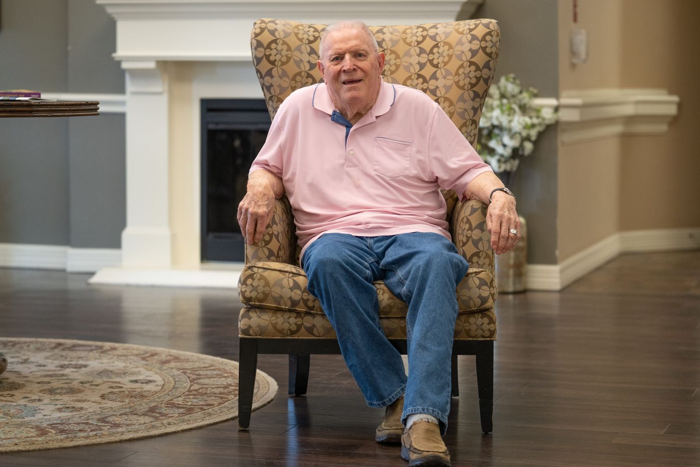 Resident sitting comfortably in a lobby area