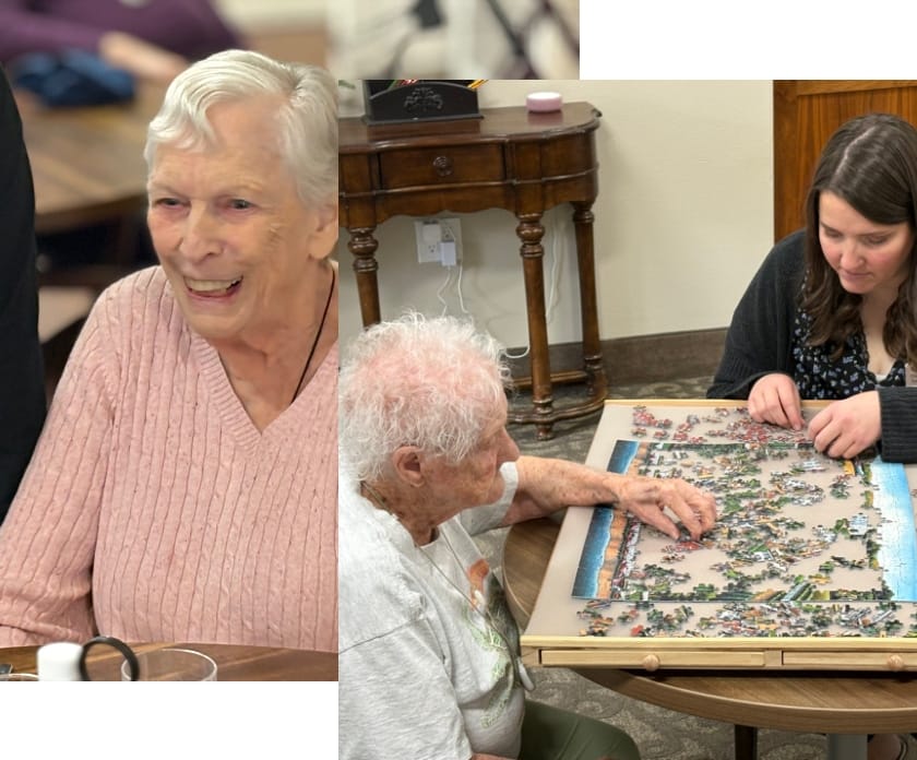 Residents engaged in a puzzle activity in a common area