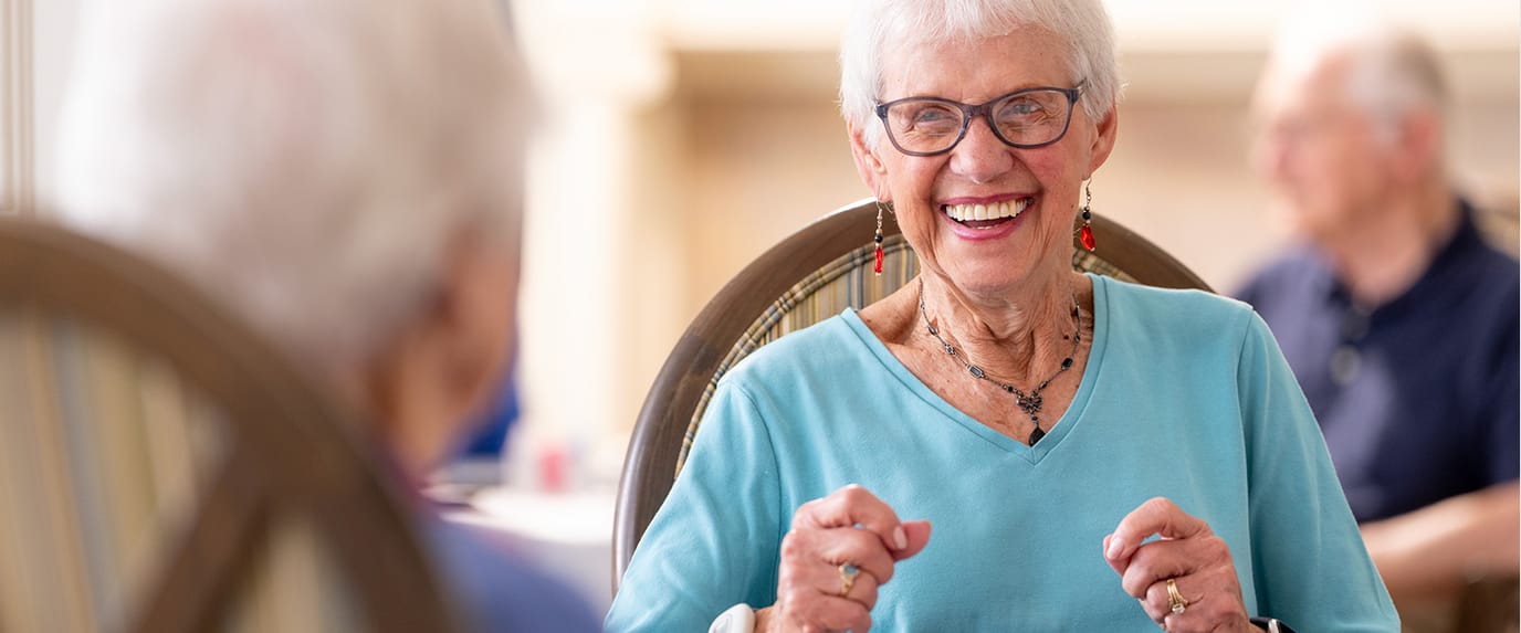 Happy resident enjoying an activity with friends