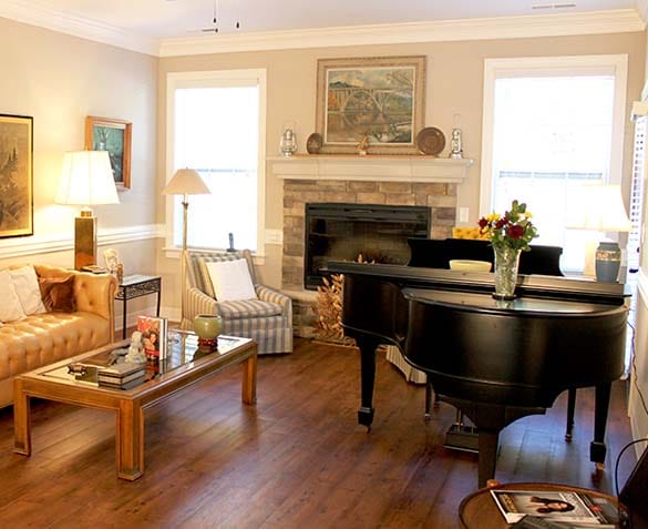 Cozy common area with a grand piano and seating