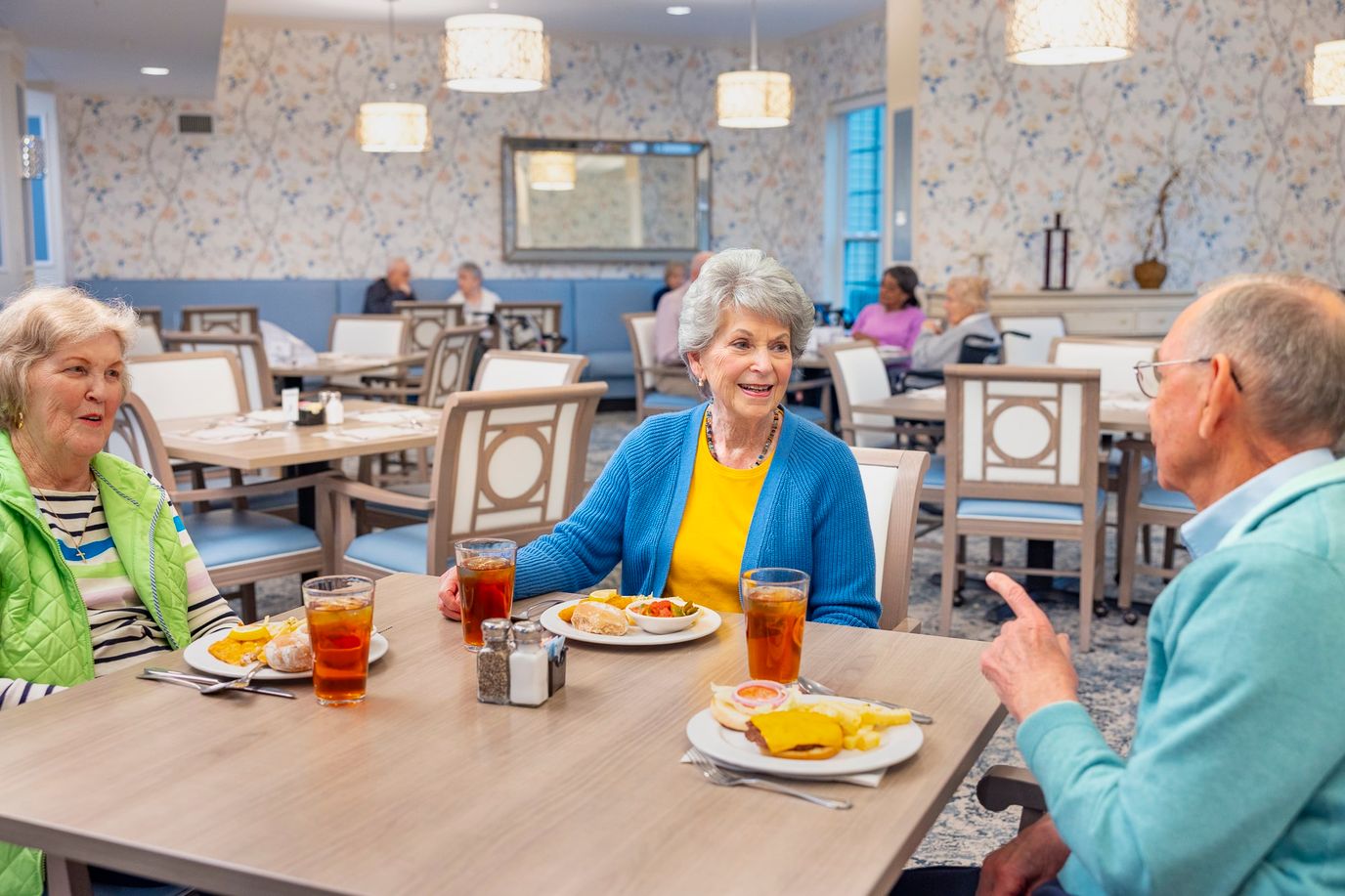 Residents enjoying a meal in the dining room