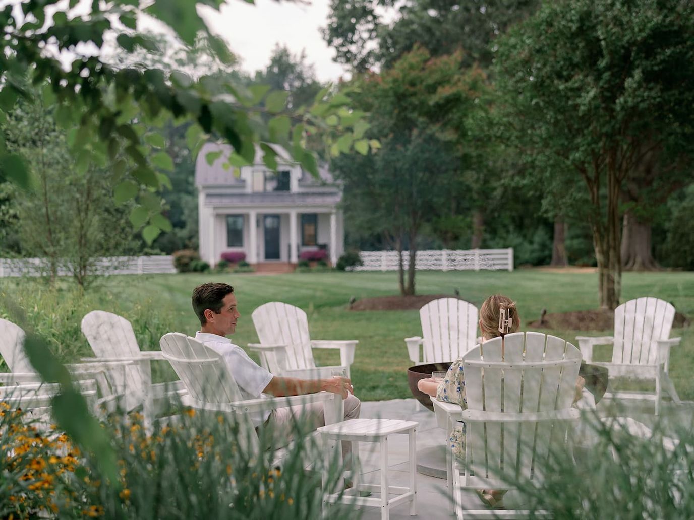 Two residents enjoying the garden seating area