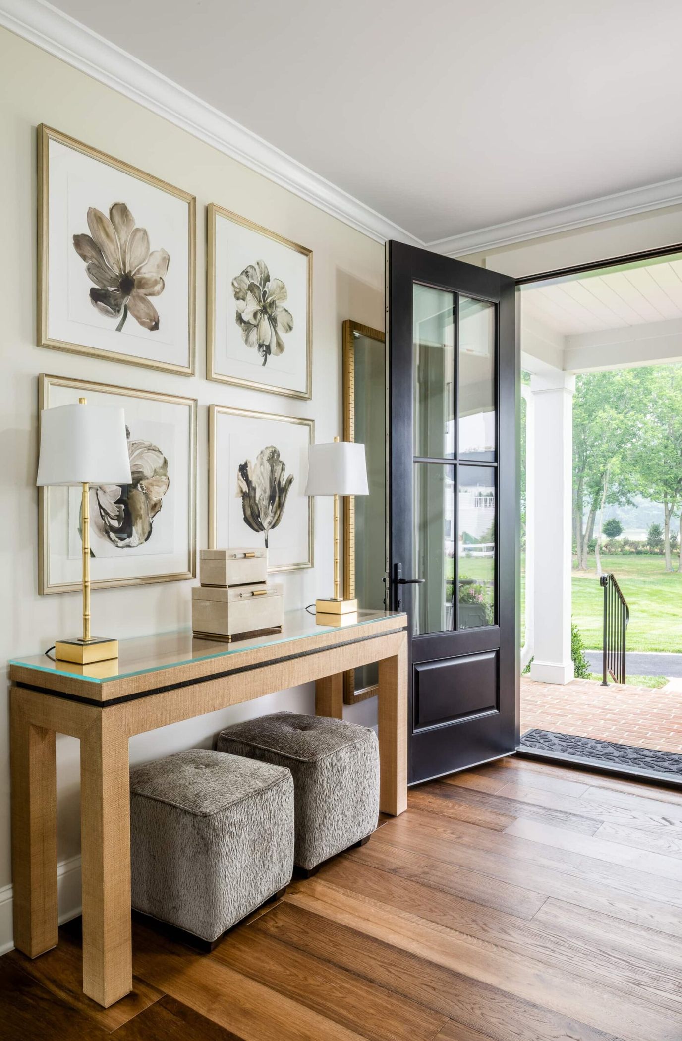 Bright, welcoming entryway with floral artwork