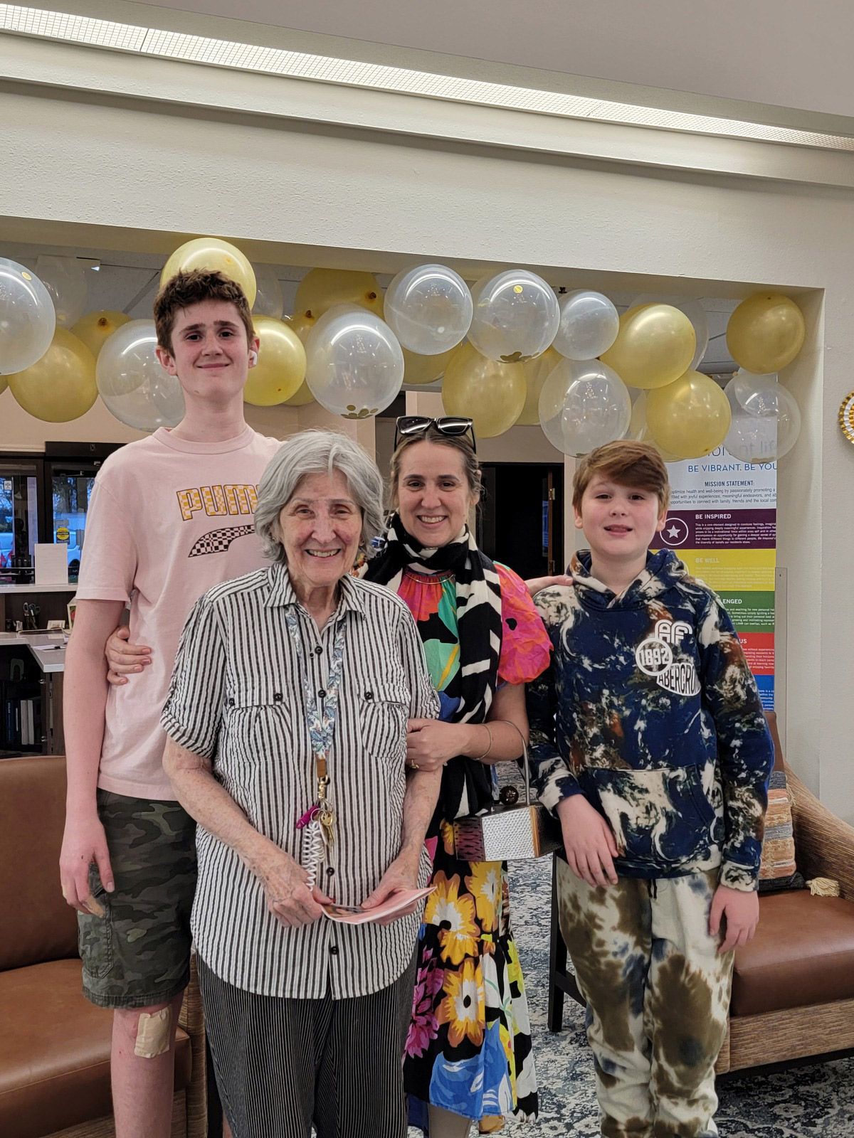 Residents and family members celebrating in a common area