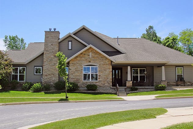 Exterior view of an assisted living facility with landscaped areas