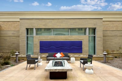 Outdoor lounge area with seating and fire pit