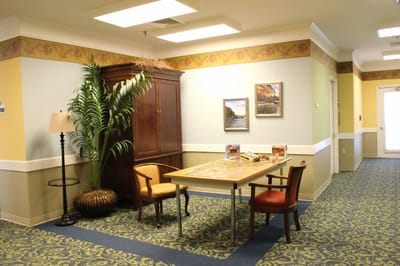 A cozy common area with a table and chairs