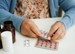Arcadia of Crofton II, Nursing Home in Gambrills, MD — Hands holding a blister pack of medication