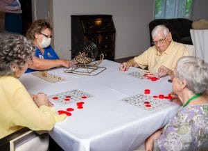 Arcadia of Crofton II, Nursing Home in Gambrills, MD — Seniors playing bingo at a table with markers